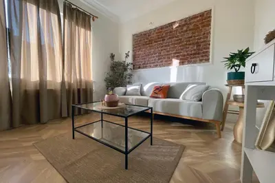 a living room with a couch and a glass table at cozy 2BR 2BATH with balcony near to nişantaşi and taksim #4 in Istanbul