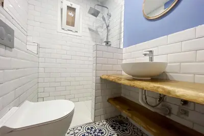 a white bathroom with a sink and a toilet at cozy 2BR 2BATH with balcony near to nişantaşi and taksim #4 in Istanbul