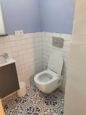 a bathroom with a toilet and a sink at baesment 2BR apt with 2toilet and 2bath 8min to metro #1 in Istanbul