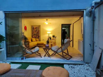 a living room with two chairs and a couch at baesment 2BR apt with 2toilet and 2bath 8min to metro #1 in Istanbul