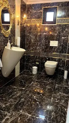 a bathroom with a sink toilet and a mirror at Cloud Nine by Alara - Luxury Private Pool and Garden Villa in Beylikduzu