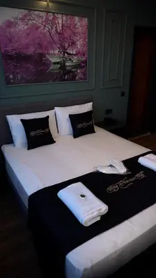 a large bed with towels on top of it at Hmz Premium Konaklama Çekmeköy in Çekmeköy