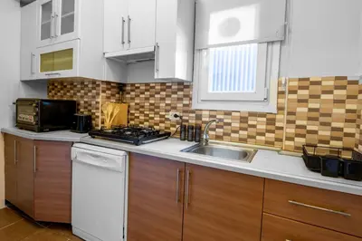 a kitchen with a sink and a stove at Fully Equipped & Modern Designed Spectacular 3BR in Istanbul