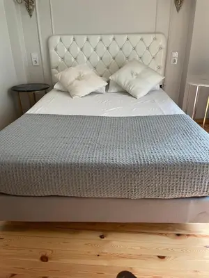 a bed with two pillows on top of it at Pink Home 4 in Istanbul