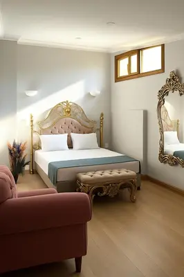 a bedroom with a king sized bed and a couch at PeraHomes in Istanbul