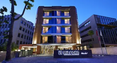 a building with a sign in front of it at Milport Hotel Levent Istanbul in Istanbul