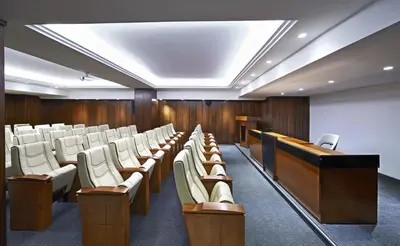 a lecture hall with rows of chairs and a podium at Milport Hotel Levent Istanbul in Istanbul