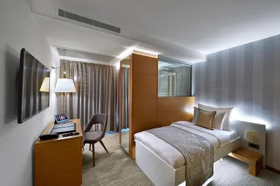a hotel room with a bed and a desk at Milport Hotel Levent Istanbul in Istanbul