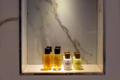 four bottles of oils sitting on a shelf at Berjer Boutique Hotel & Spa in Istanbul
