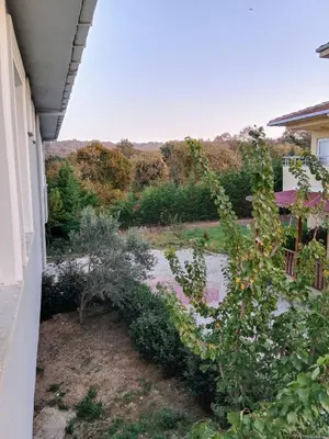 a view of a garden from the balcony of a house at forest villa, breakfast hotel, 6 minutes from Istanbul airport in Arnavutköy