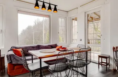 a living room with a table and chairs and a couch at Villa Sapanca in Sapanca