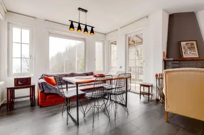 a living room with a table and a couch at Villa Sapanca in Sapanca