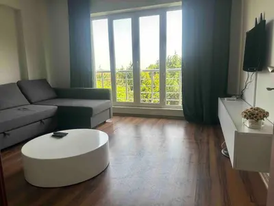 a living room with a couch and a coffee table at Sabina gokcene 5 dk in Istanbul