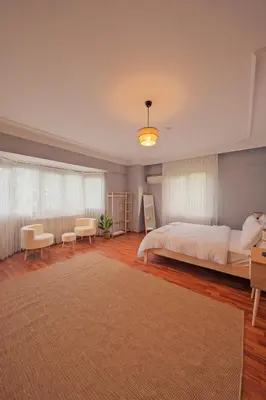 a bedroom with a large bed and a large rug at Kiwii Sapanca in Sapanca