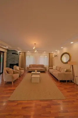 a large living room with couches and a rug at Kiwii Sapanca in Sapanca