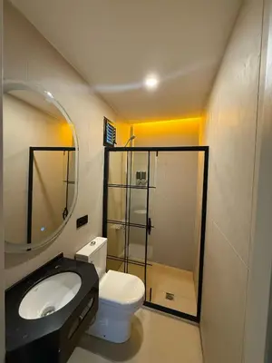 a bathroom with a toilet and a sink and a mirror at Nest Ortaköy in Istanbul