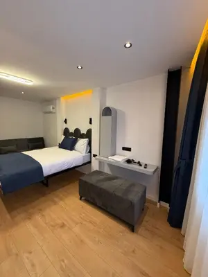 a bedroom with a bed and a couch in it at Nest Ortaköy in Istanbul
