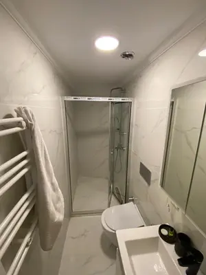 a bathroom with a shower and a toilet and a sink at RAMOS İSTANBUL OLD CİTY CENTEr in Istanbul