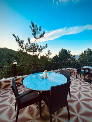 a patio with a table and chairs on a balcony at Niceland İznik