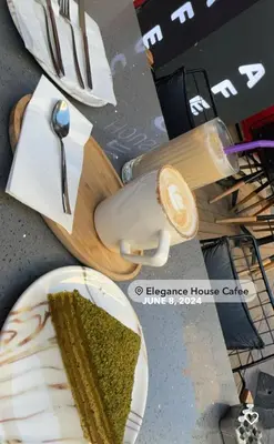 a table with a plate of cake and a spoon at elegance famıly house in Istanbul