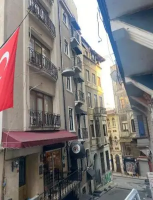a tall building with balconies on a city street at elegance famıly house in Istanbul