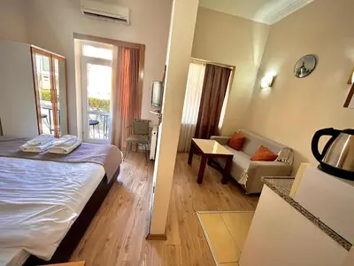 a hotel room with a bed and a living room at elegance famıly house in Istanbul