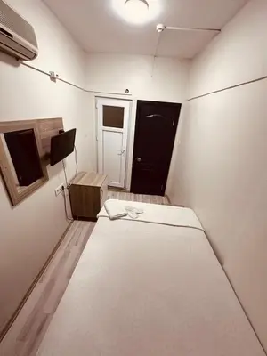 a small room with a bed and a door at Sera Hotel in Istanbul