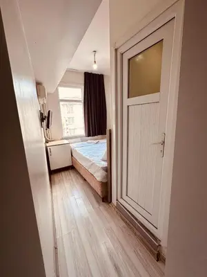 a bedroom with a bed and a window and a door at Sera Hotel in Istanbul