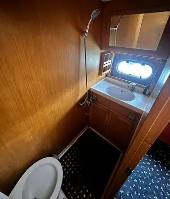 a small bathroom with a toilet and a sink at Pruva Yacht in Istanbul
