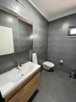 a bathroom with a sink and a toilet at Sakarya Sapanca Ünlüce de 5 oda 1 salon Özel Havuzlu Lux 10 kişilik Tatil Villası in Sapanca