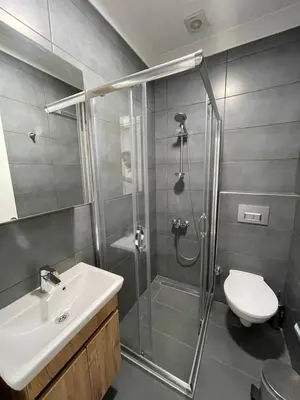 a bathroom with a shower and a toilet and a sink at Sakarya Sapanca Ünlüce de 5 oda 1 salon Özel Havuzlu Lux 10 kişilik Tatil Villası in Sapanca