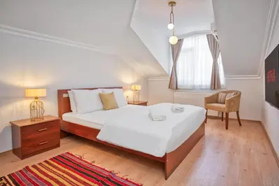 a bedroom with a bed and a desk and a chair at Dublex 3 Bedrooms&2Bathrooms &Terrace in Istanbul
