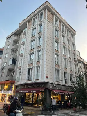 a large building on the corner of a street at Dublex 3 Bedrooms&2Bathrooms &Terrace in Istanbul