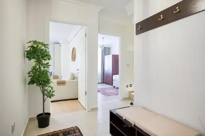 a living room with a couch and a potted plant at Dublex 3 Bedrooms&2Bathrooms &Terrace in Istanbul