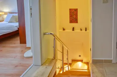 a yellow room with a staircase and a bed at Dublex 3 Bedrooms&2Bathrooms &Terrace in Istanbul