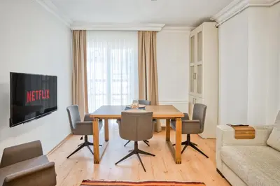 a living room with a dining room table and a couch at Dublex 3 Bedrooms&2Bathrooms &Terrace in Istanbul