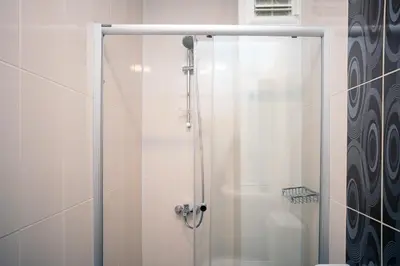 a shower with a glass door in a bathroom at Dublex 3 Bedrooms&2Bathrooms &Terrace in Istanbul
