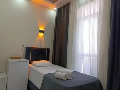 a bedroom with a bed and a window at King Mas Suit in Istanbul