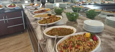 a buffet with many bowls of food on a table at Sare Hotel in Erdek
