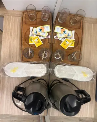 a table with glasses and a tea pot and shoes at İstanbulhome in Istanbul