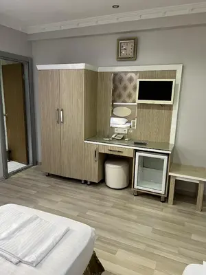a bedroom with a bed and a desk in it at ORAL hotel in Istanbul