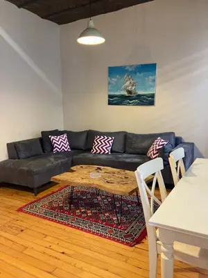 a living room with a couch and a table at Feridiye 3 Oda 1 salon Daire in Istanbul