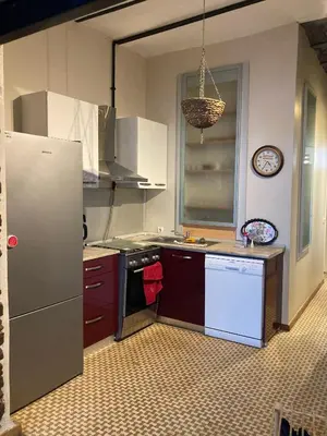 a kitchen with a refrigerator and a stove top oven at Feridiye 3 Oda 1 salon Daire in Istanbul
