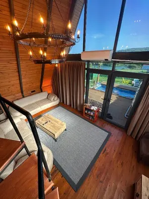a room with a couch and a chandelier at Gölköy Bungalov Kandıra in Kandıra