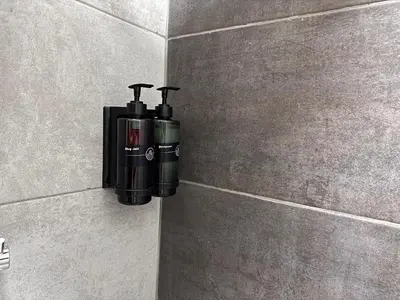 a soap dispenser on a wall in a bathroom at MAHAL Otel PENDİK in Istanbul