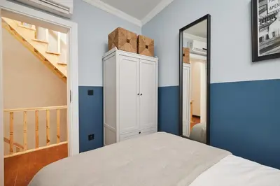 a bedroom with a white cabinet and a mirror at Private House near Taksim in Istanbul