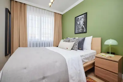 a bedroom with a large bed and a window at Private House near Taksim in Istanbul