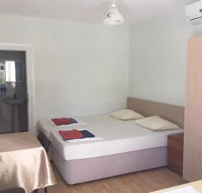 a bedroom with a bed with two towels on it at boncuk motel in Marmara