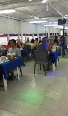 a group of people sitting at tables on a train at boncuk motel in Marmara
