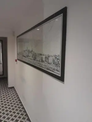 a picture hanging on a wall with a picture on it at Pera Standard Rooms in Istanbul